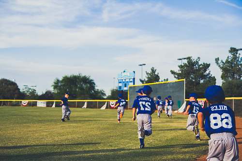 sports boy running on green grass team
