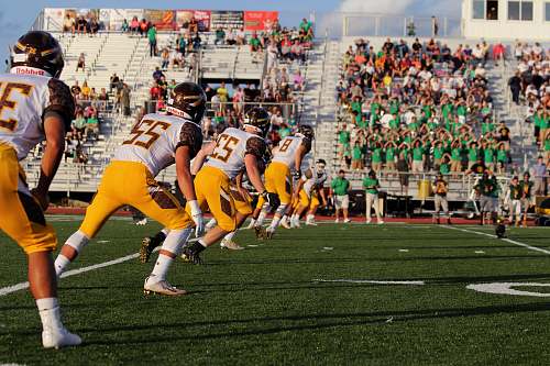 team football game photo during daytime football