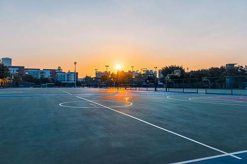 sports gray buildings during daytime asphalt