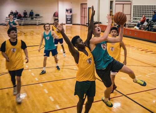 team group of people playing basketball people