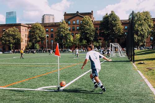 soccer man playing soccer on ballpark football