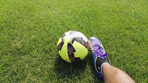 football person kicking soccer ball soccer