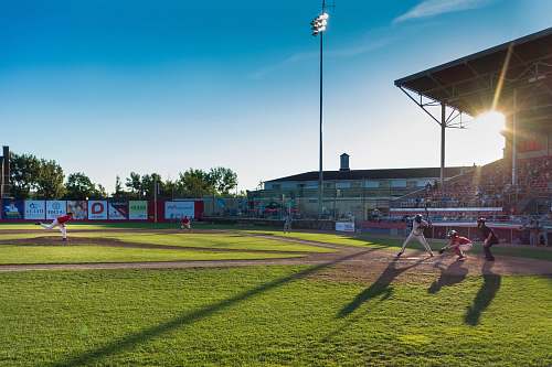 sports player playing baseball on ballpark baseball