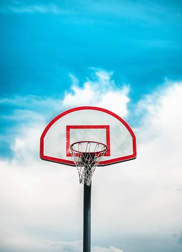 basketball red and black basketball hoop under cloudy sky hoop