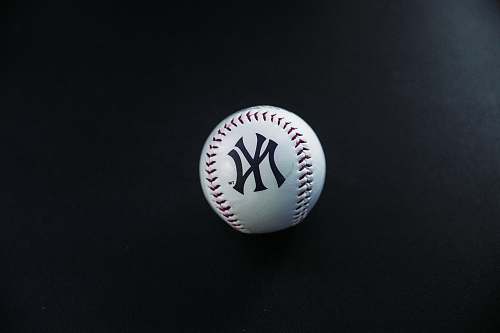 apparel white and red New York Yankees baseball on black surface clothing