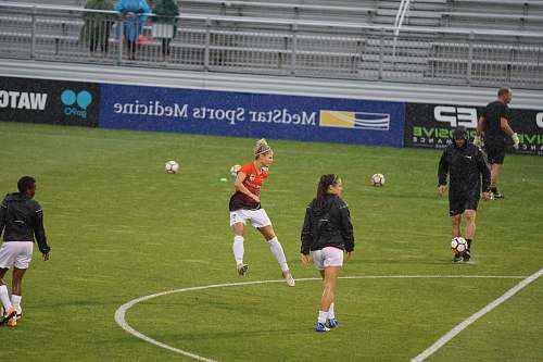 team woman standing on soccer field soccer