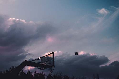 grey basketball ball into the air at the court sport