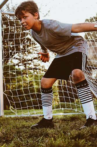soccer boy in gray shirt human