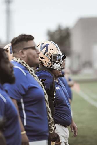 helmet group of football players on field football