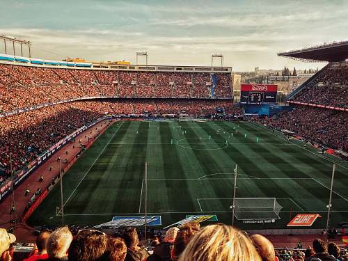 madrid green soccer field with crowd at daytime spain