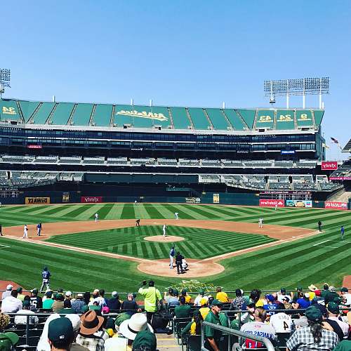 arena photo of people watching game baseball match on baseball field building