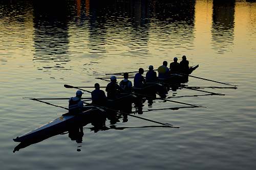 vehicle men rowing boat boat