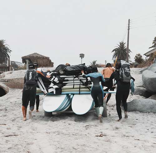 vehicle people in wet suit during daytime vessel