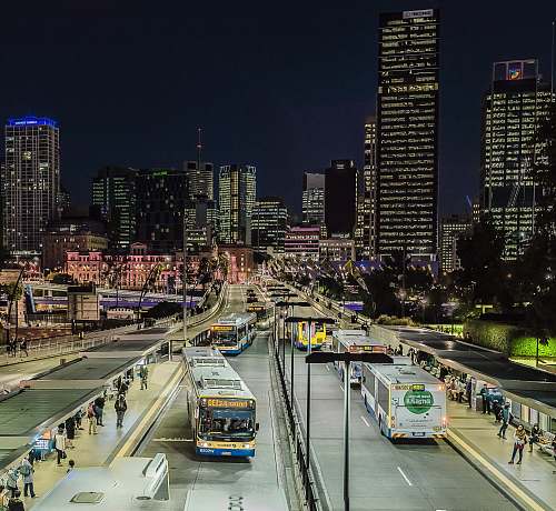 building lighted city with busy street and high-rise buildings city