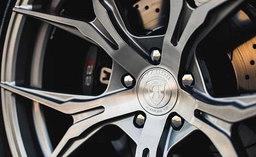 car shallow focus photography of vehicle wheel car wheel