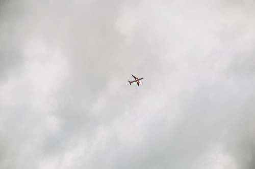 grey airplane in low-angle photo frame black-and-white