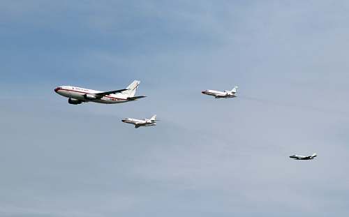 bird four white airliners flying