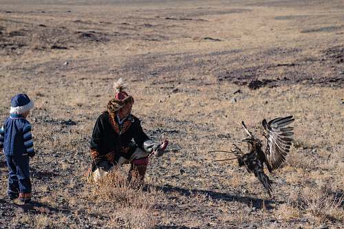 bird man and boy beside bird vulture