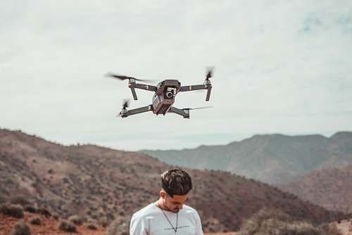bird man wearing white shirt flying