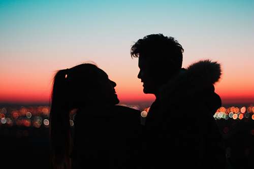  silhouette of man and woman near outdoor 