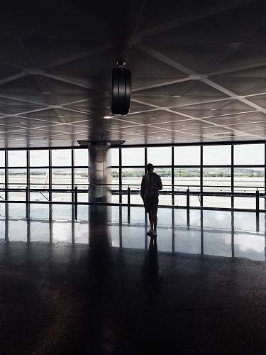 man silhouette photo of person inside building male