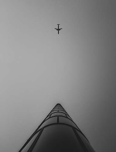 black-and-white airliner in flight flying