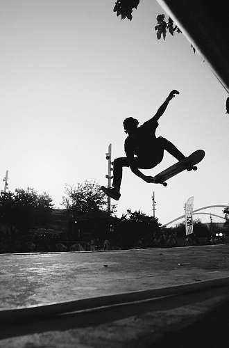 silhouette silhouette of man doing skateboard trick athens