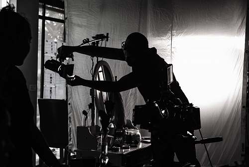 person silhouette of person holding camera human