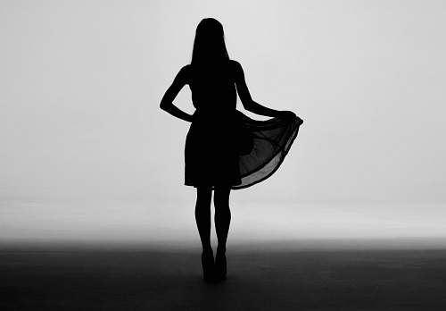 silhouette silhouette of woman holding skirt of dress person