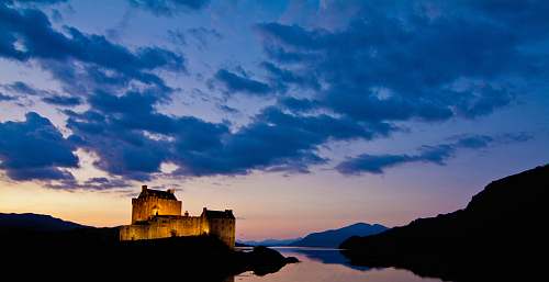 building castle near body of water architecture