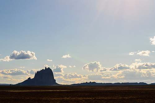 sky grey stone formation under blue sky mountain