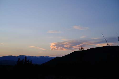 sky silhouette mountain during golden hour dusk