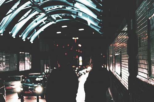 germany two people standing near road city
