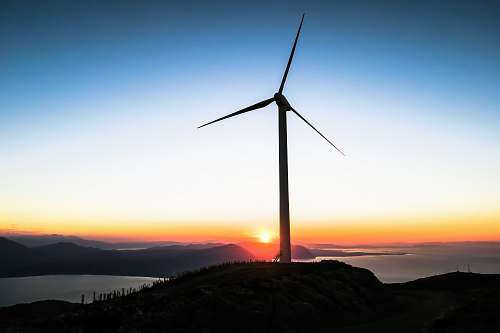turbine silhouette of wind mill during golden hour wind
