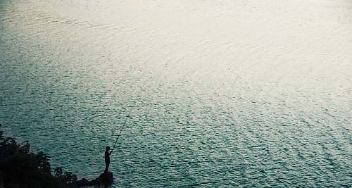 nature person stand on rock near body of water during daytime sea