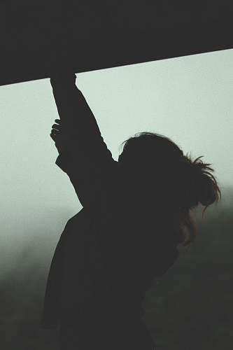 silhouette silhouette of woman reaching person