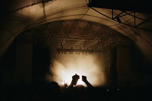 stage silhouette photography of group of people on concert music
