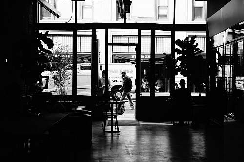 silhouette grayscale photo of house and people black-and-white