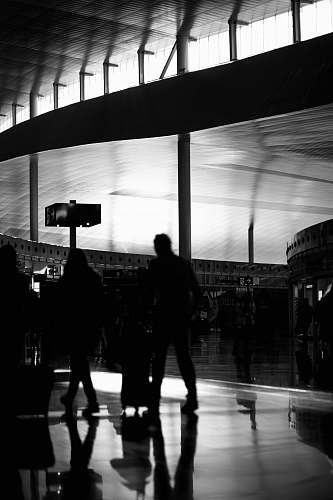 people grayscale photography of group of people walking black-and-white