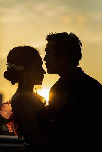 person man and woman hugging each other light