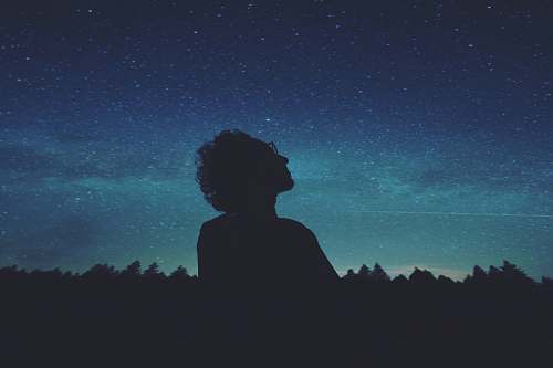 person man looking at the skies blue