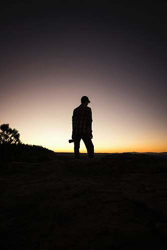 person man standing under white and black sky people