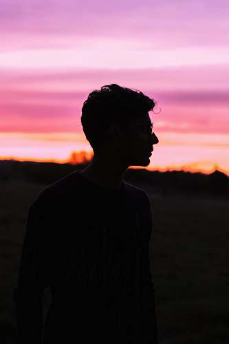person man wearing black frame sunglasses nature