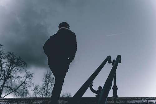 person person walk near two slide during nighttime silhouette