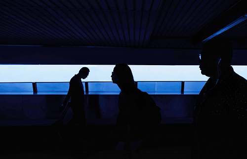 person silhouette of people inside a dark room people