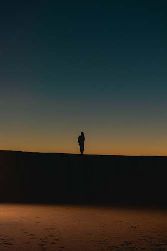 outdoors silhouette of person standing on black surface nature