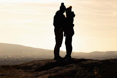 person silhouette photography of couple standing