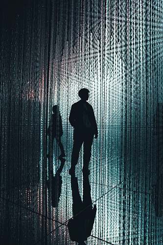 person silhoutte of man lighting
