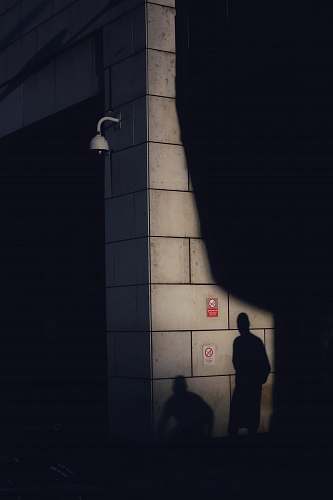 person two shadows on wall people
