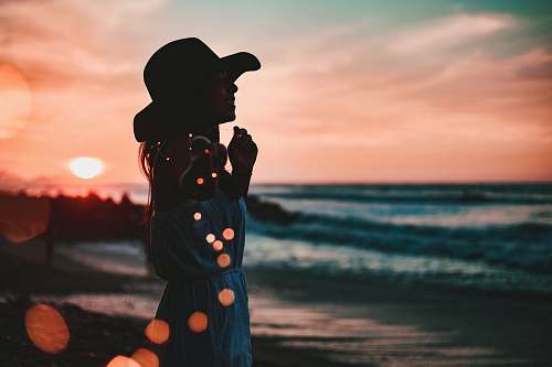 person woman in seashore during golden hour people